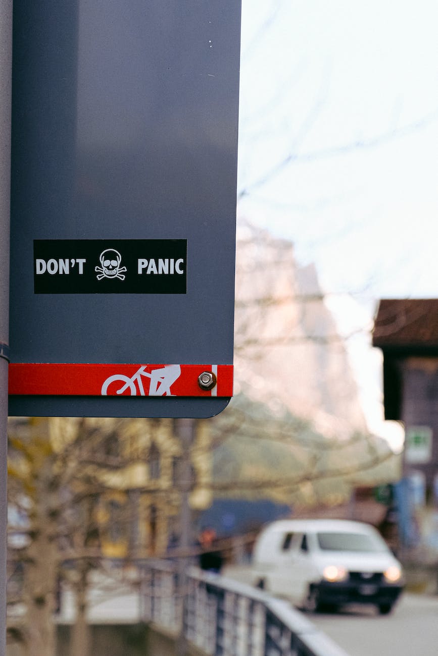 Don't panic sticker on sign